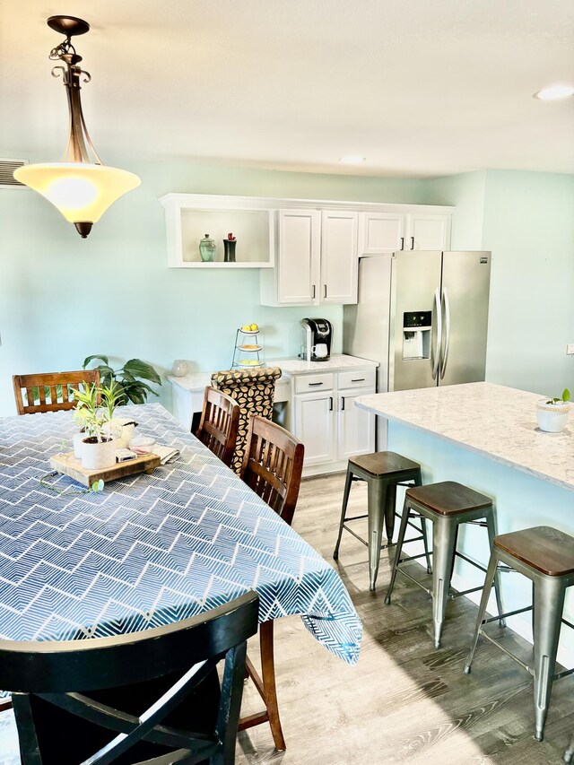 dining room featuring light hardwood / wood-style floors