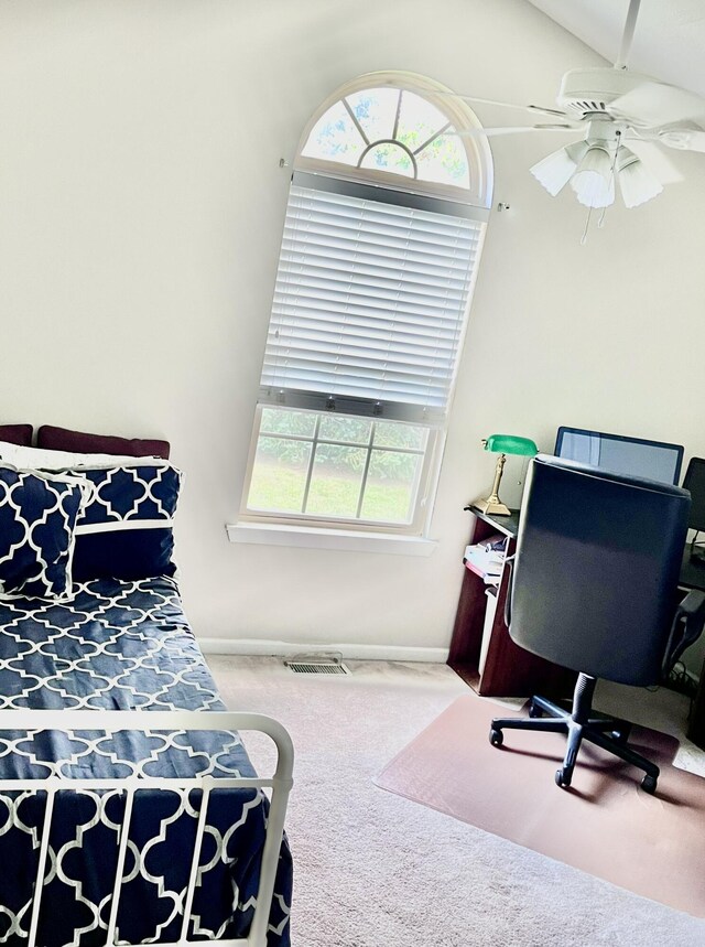 bedroom featuring vaulted ceiling, carpet flooring, and ceiling fan