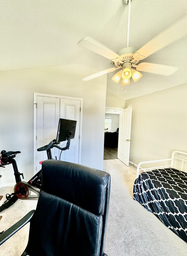 bedroom featuring ceiling fan, carpet flooring, and vaulted ceiling