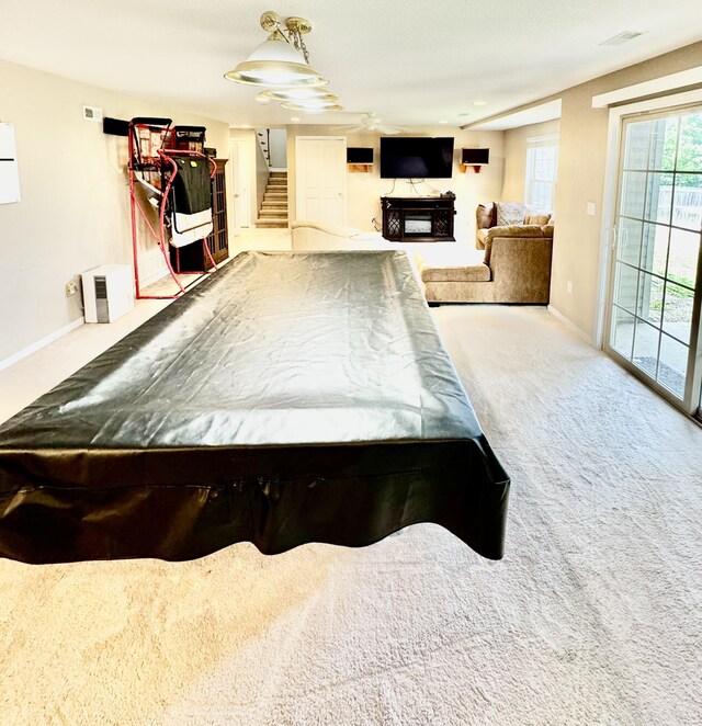 recreation room featuring carpet flooring