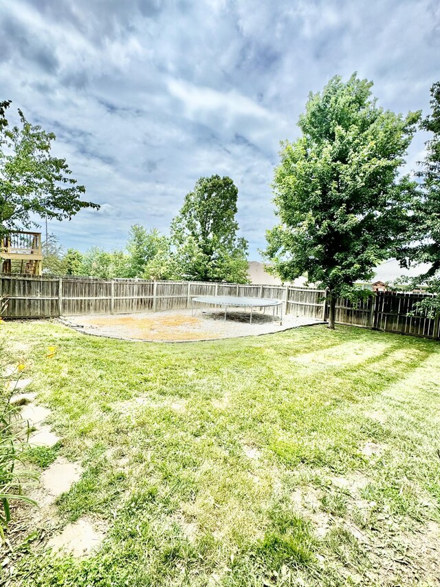 view of yard with a trampoline