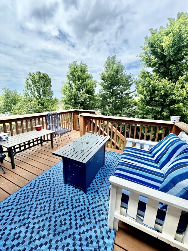 deck with an outdoor fire pit