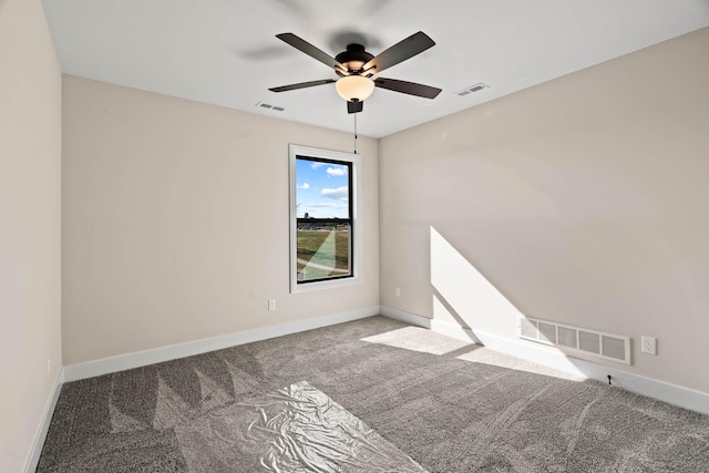 empty room featuring carpet flooring and ceiling fan