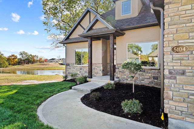 exterior space with a yard and a water view