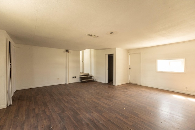 empty room featuring dark hardwood / wood-style flooring