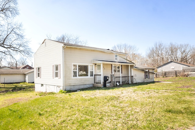 rear view of house with a lawn