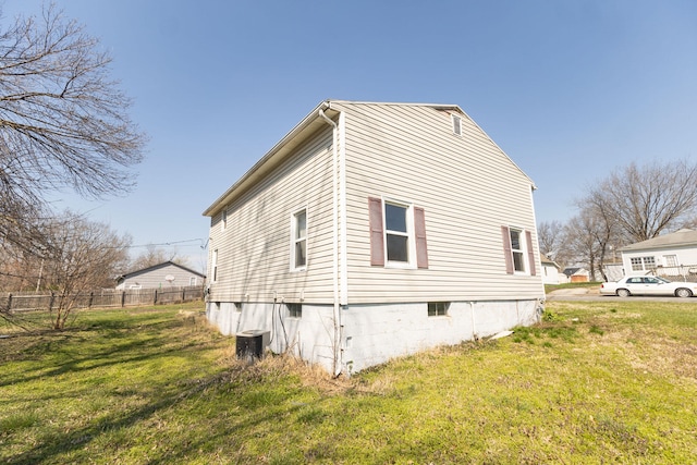 view of property exterior featuring a lawn