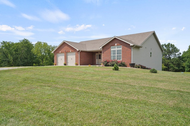 single story home featuring a front yard and a garage