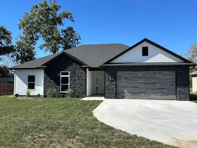 modern farmhouse style home with a front yard and a garage