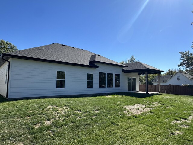 108 Lisa Ct, Hallsville, MO 65255 - back of house with a patio and roof with shingles