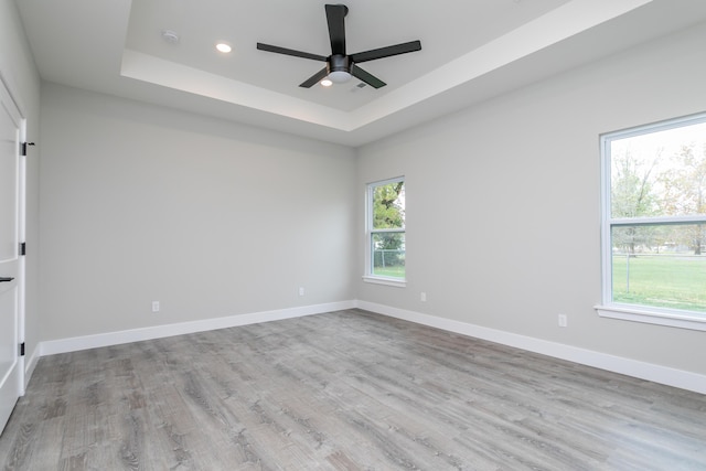 108 Lisa Ct, Hallsville, MO 65255 - unfurnished room featuring a tray ceiling, plenty of natural light, ceiling fan, and recessed lighting