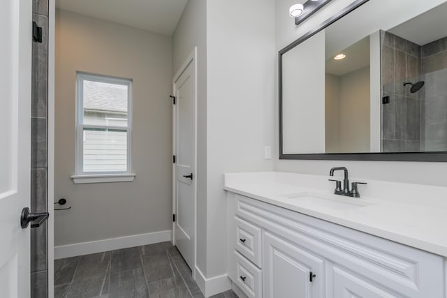 108 Lisa Ct, Hallsville, MO 65255 - full bathroom with baseboards, a tile shower, and vanity