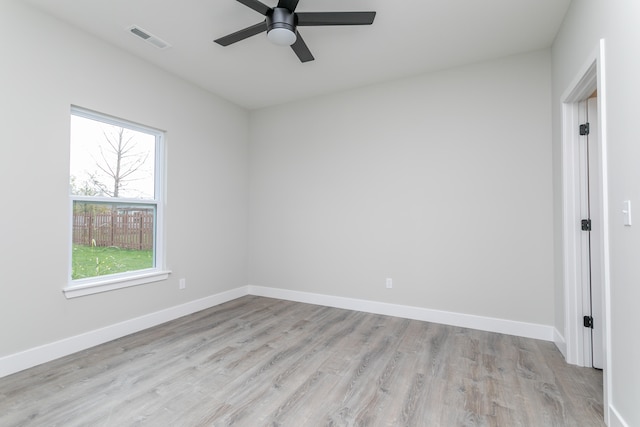 spare room featuring light hardwood / wood-style floors and ceiling fan