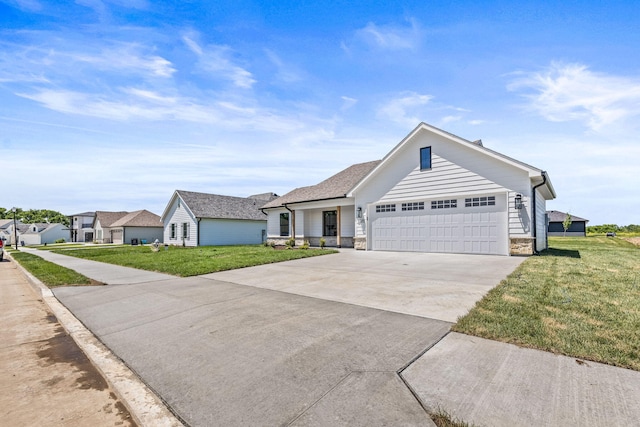 ranch-style home featuring a front lawn and a garage