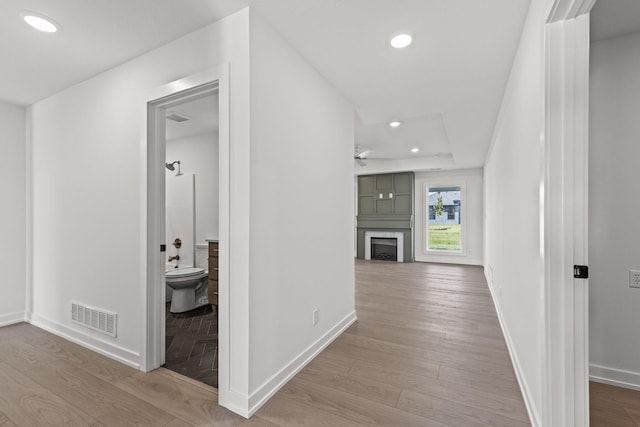 hall with light wood-type flooring