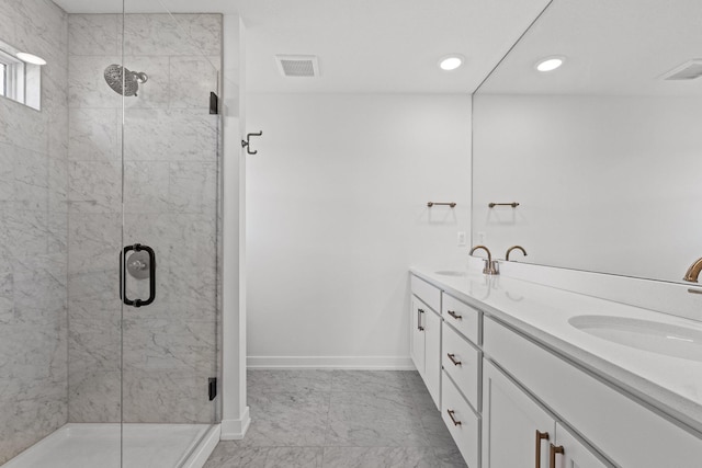 bathroom featuring vanity and a shower with shower door