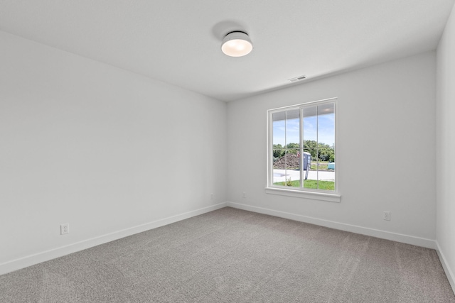 unfurnished room featuring carpet