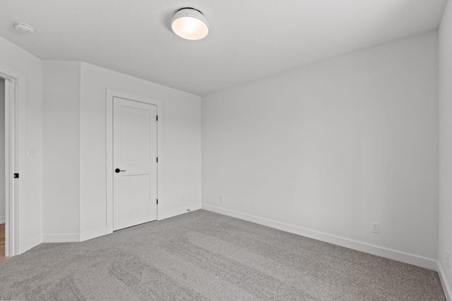 unfurnished room featuring carpet