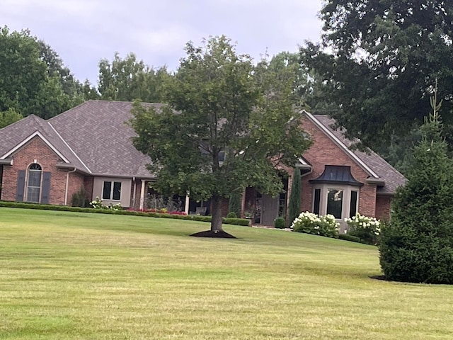 view of front of home with a front yard