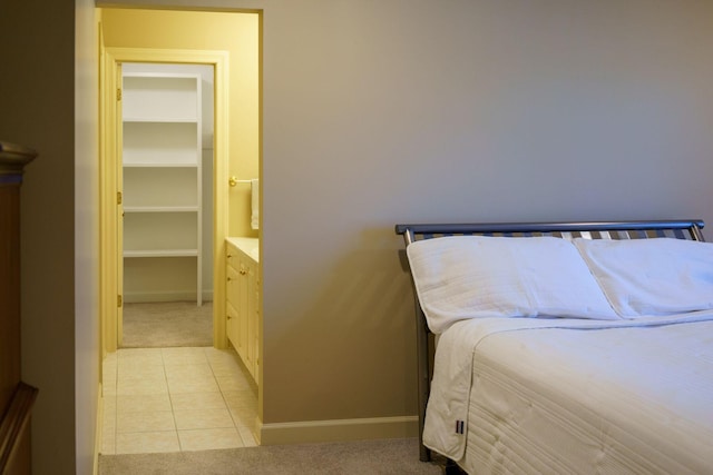 bedroom featuring light tile floors