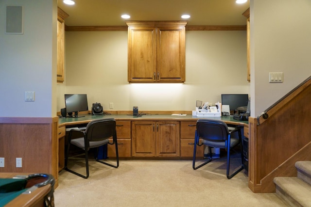 office area with crown molding and light colored carpet