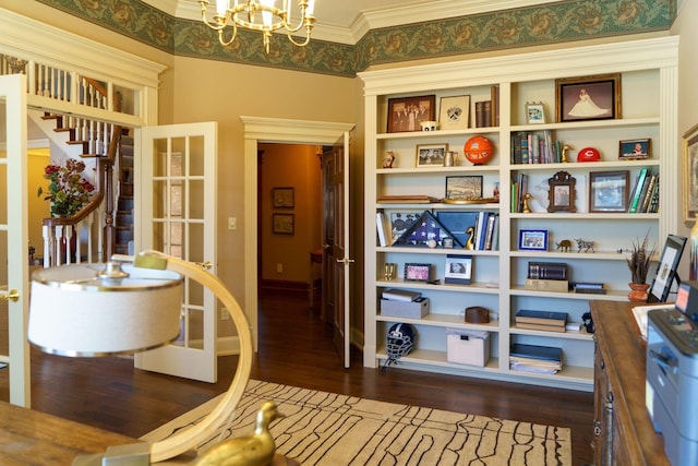 interior space featuring crown molding, dark hardwood / wood-style flooring, and a notable chandelier