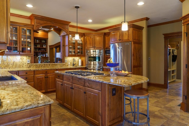 kitchen featuring dark tile floors, hanging light fixtures, stainless steel appliances, a kitchen island, and tasteful backsplash