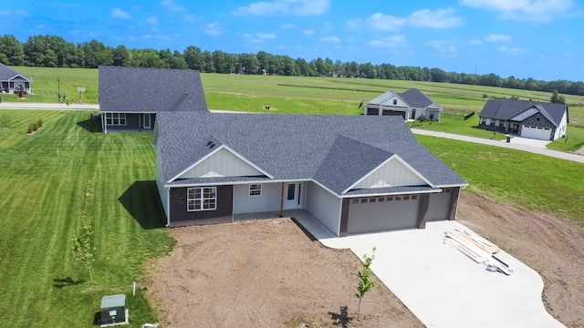 view of front facade with a garage and a front yard