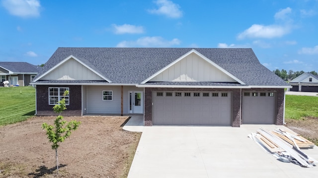 view of front of home featuring a garage and a front lawn