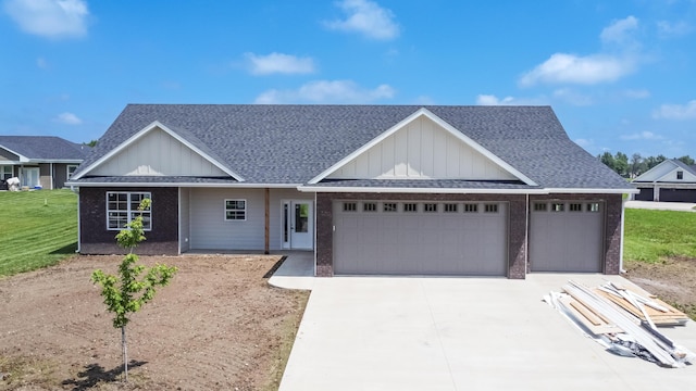 single story home featuring a shingled roof, concrete driveway, a garage, board and batten siding, and brick siding