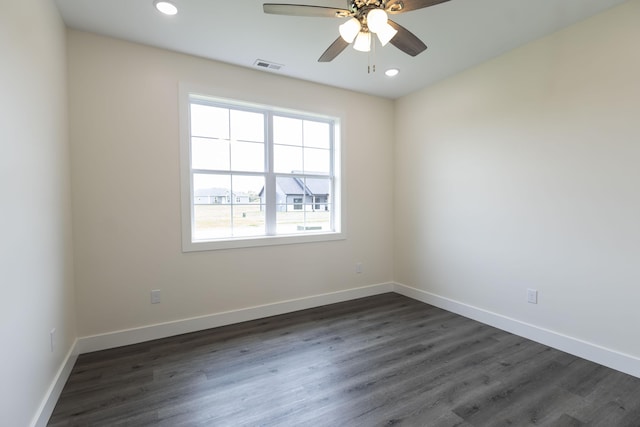 empty room featuring visible vents, baseboards, dark wood finished floors, recessed lighting, and ceiling fan