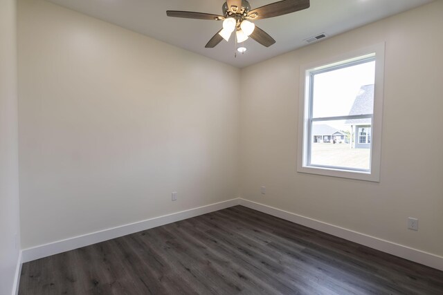 unfurnished room featuring ceiling fan and dark hardwood / wood-style flooring