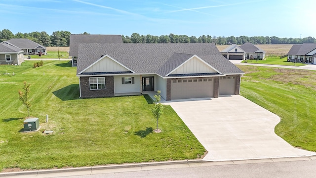 911 Destinee Dr, Moberly, MO 65270 - view of front of property with an attached garage, roof with shingles, brick siding, and concrete driveway