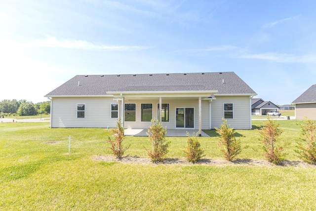 911 Destinee Dr, Moberly, MO 65270 - back of property with a lawn and a patio area