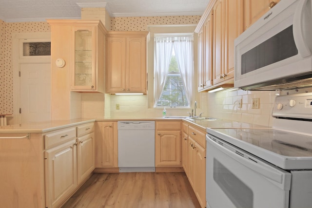 kitchen with tasteful backsplash, light brown cabinets, white appliances, and light wood-type flooring