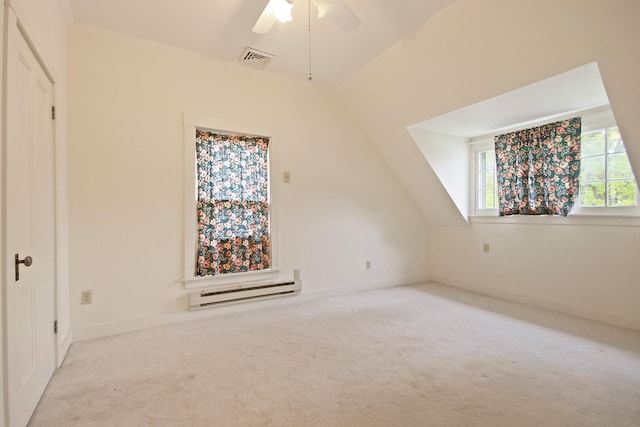 bonus room with vaulted ceiling, ceiling fan, carpet flooring, and baseboard heating