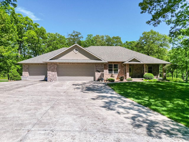 ranch-style home featuring a front lawn and a garage