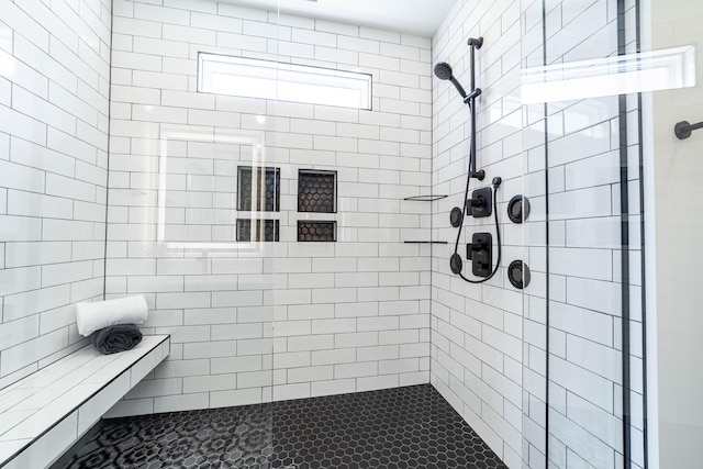 bathroom featuring tiled shower