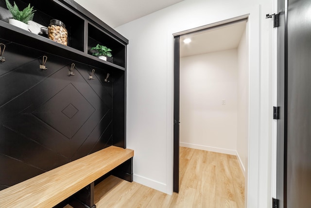 mudroom with light hardwood / wood-style flooring