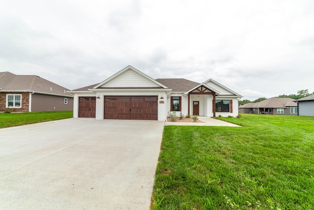 view of front facade with a garage and a front yard