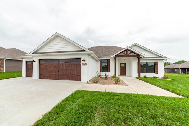 view of front of home with a garage and a front yard