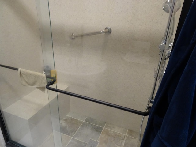 bathroom with a shower with shower door