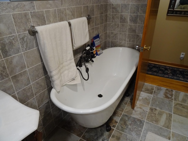 bathroom featuring tile flooring and tile walls