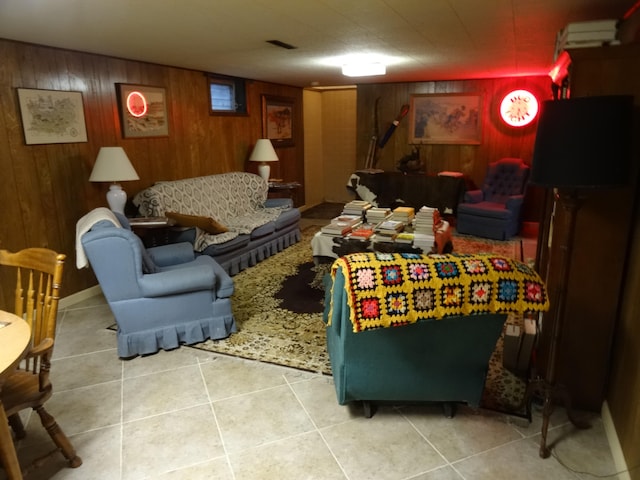 tiled living room featuring wooden walls