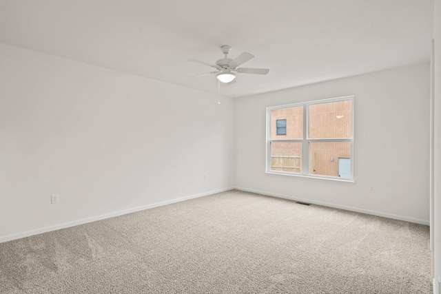 unfurnished room with carpet flooring and ceiling fan