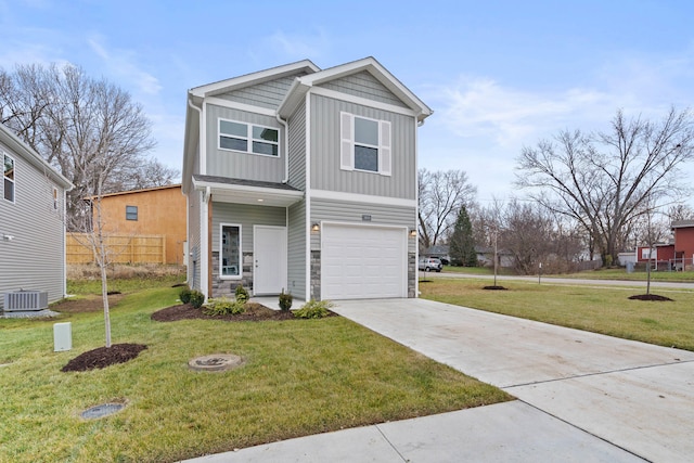 view of front of house featuring a front yard, central AC unit, and a garage