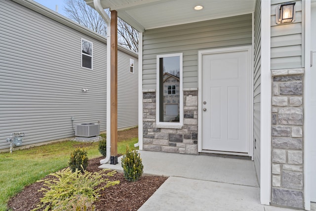 entrance to property featuring central air condition unit