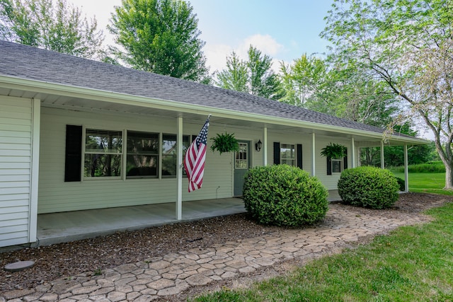 ranch-style home featuring covered porch