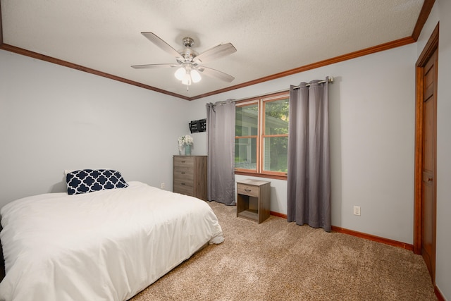 bedroom featuring crown molding, a textured ceiling, ceiling fan, and light colored carpet