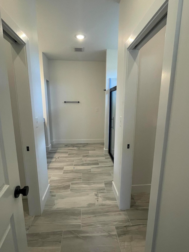 hallway with light wood-type flooring